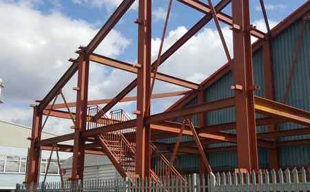 Steel frame with an internal stair, in red oxide
