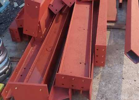 Red oxide beams, drilled for connections