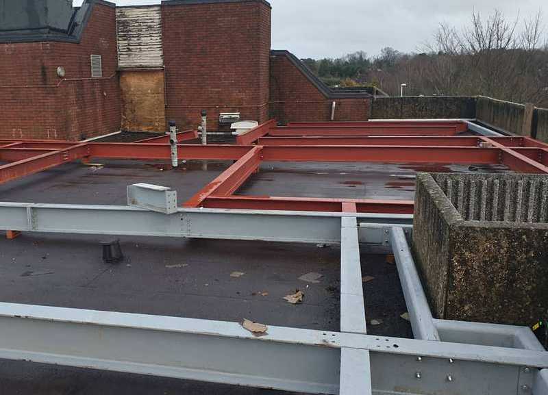 Roof-level steel deck frame