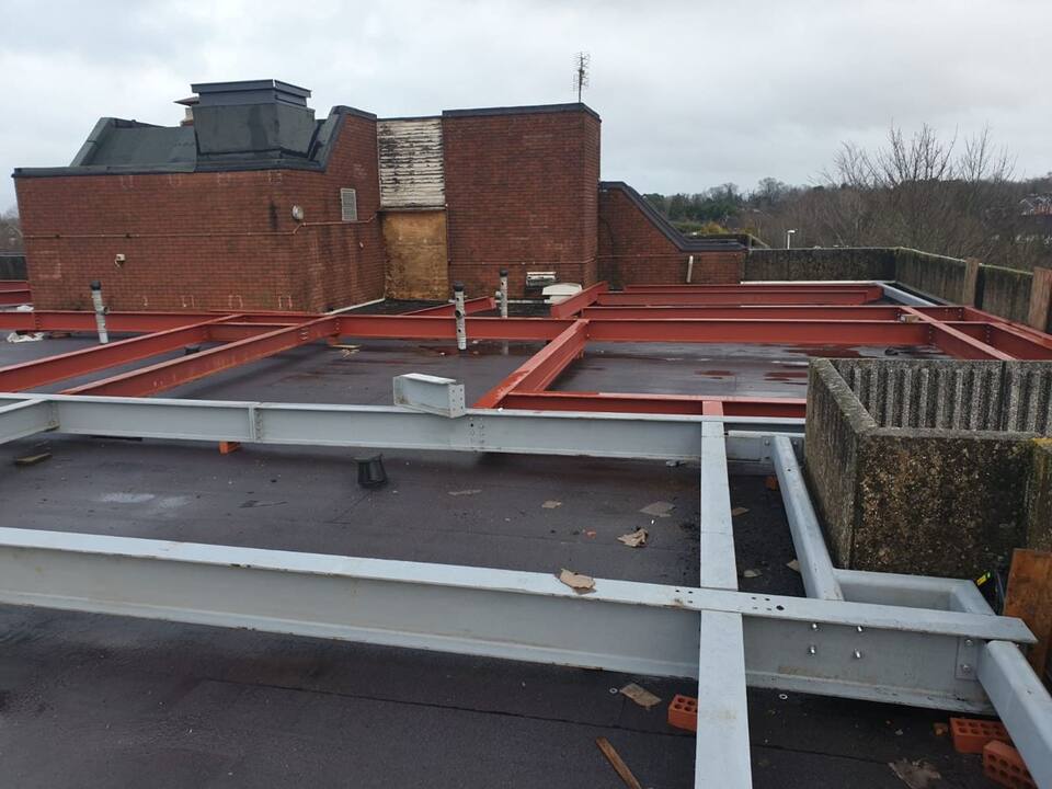 Galvanised and primed steel grid on a flat roof