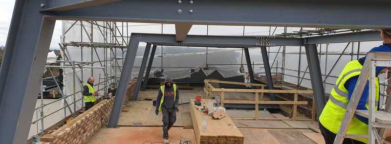 Rooftop frame: our crew fixing the steels